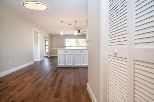 hall featuring dark wood-type flooring