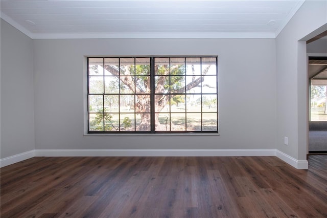 empty room with ornamental molding and dark wood-type flooring