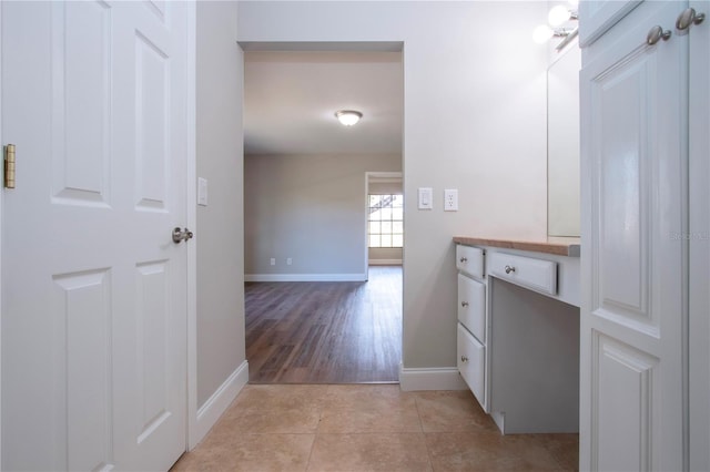 hallway featuring light tile patterned floors