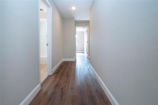 hall featuring dark wood-type flooring