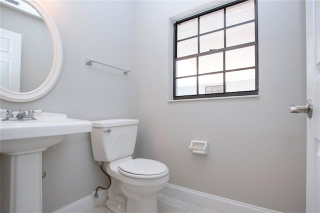 bathroom featuring tile patterned floors and toilet