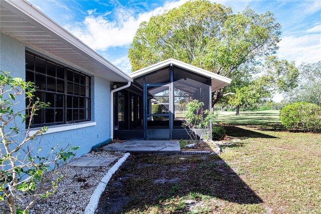 view of yard with a sunroom