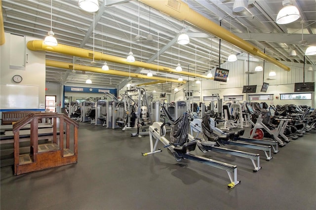 workout area featuring a high ceiling