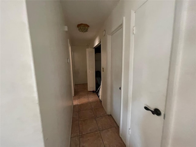 hallway with light tile patterned flooring