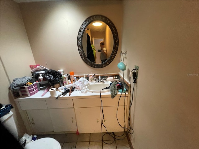 bathroom featuring tile patterned flooring and sink