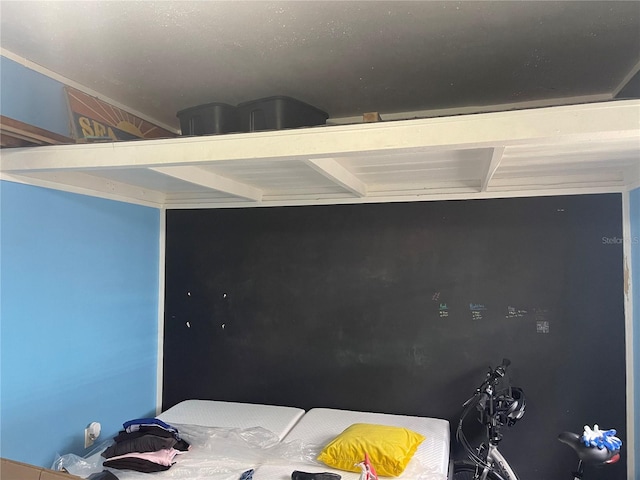 bedroom with beamed ceiling