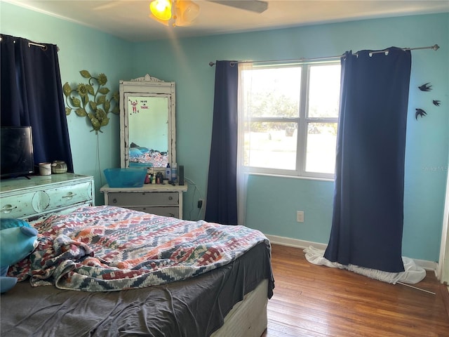 bedroom featuring light hardwood / wood-style floors and ceiling fan