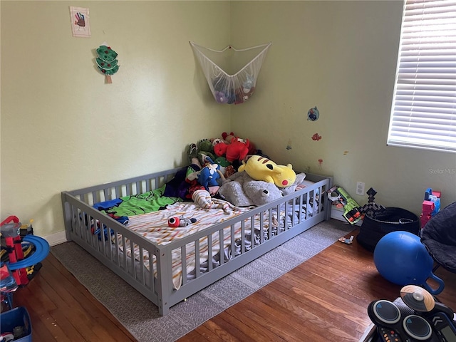 bedroom featuring wood-type flooring