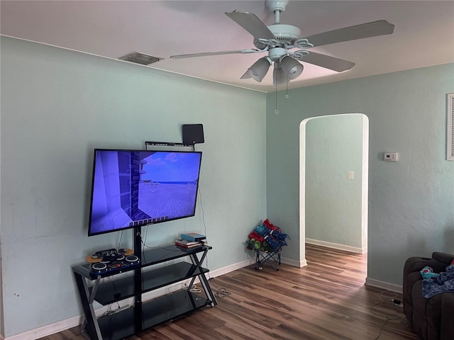 living room with hardwood / wood-style flooring and ceiling fan