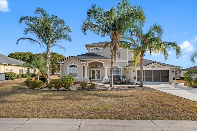 view of front of house featuring a front lawn and french doors