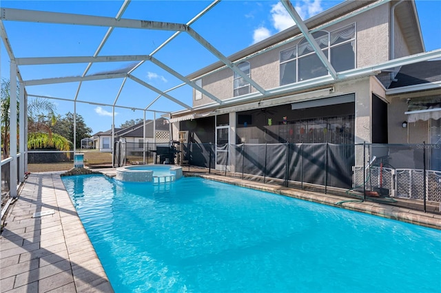 view of swimming pool featuring an in ground hot tub, glass enclosure, and a patio area