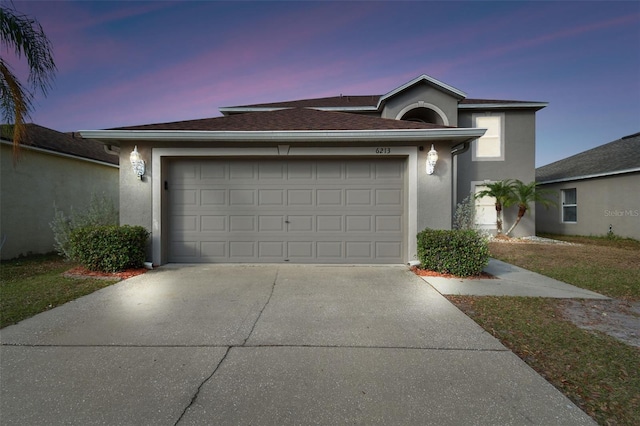 6213 Venezia Pl, Riverview, FL 33578 - view of front of home with driveway, an attached garage, and stucco siding
