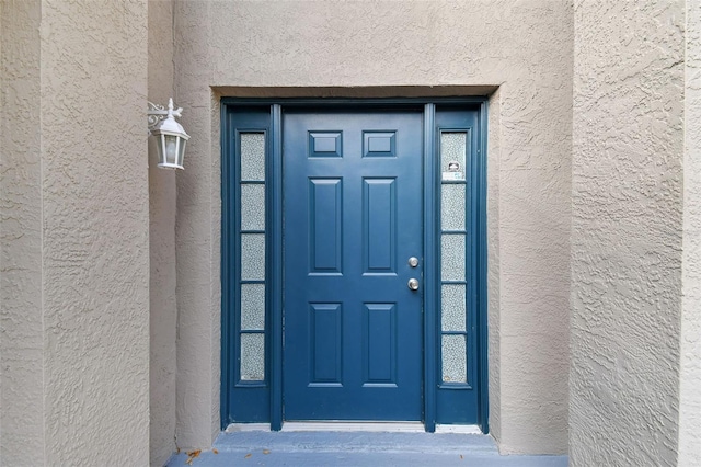 6213 Venezia Pl, Riverview, FL 33578 - doorway to property with stucco siding