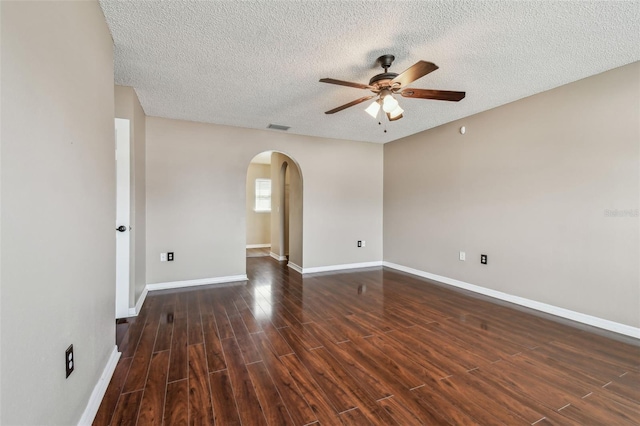 unfurnished room with ceiling fan and a textured ceiling