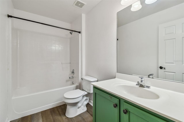 full bathroom with vanity, toilet, wood-type flooring, and tub / shower combination