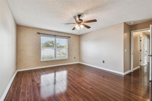 spare room with ceiling fan, dark hardwood / wood-style flooring, and a textured ceiling