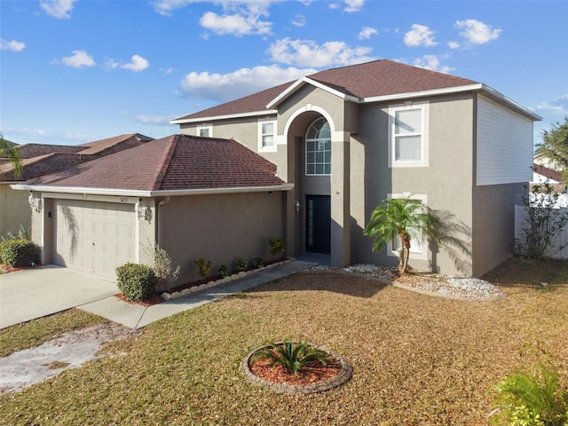 view of front property featuring a front lawn and a garage