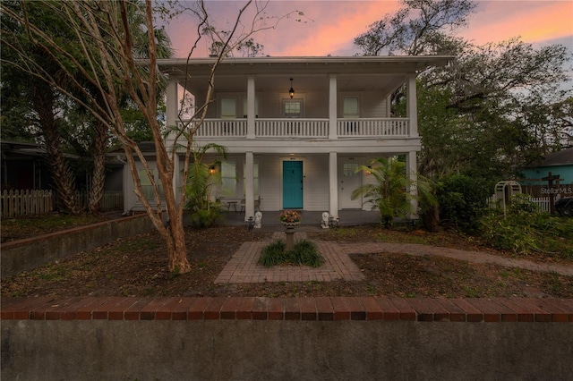 view of front of property with a balcony