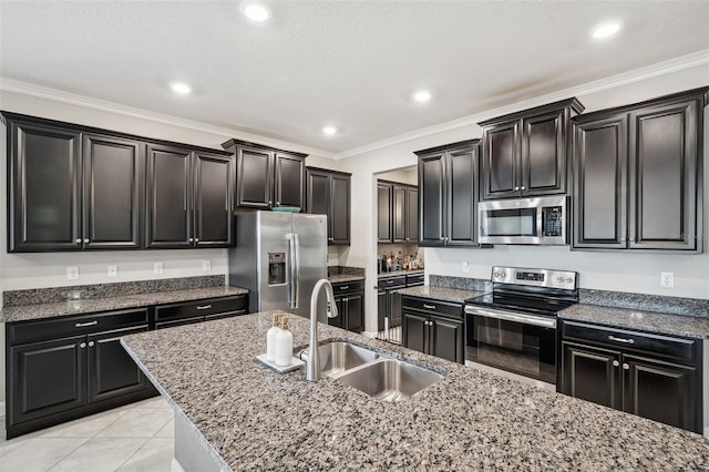 kitchen featuring stone counters, appliances with stainless steel finishes, crown molding, and sink