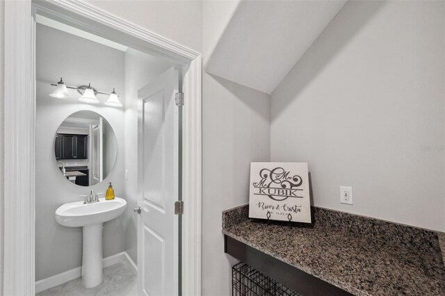 bathroom with tile patterned floors