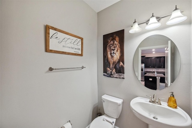 bathroom featuring sink and toilet