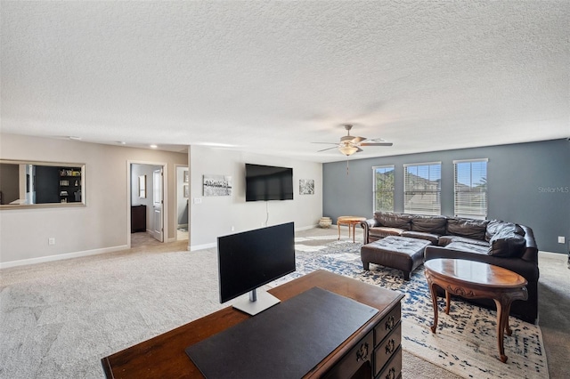 living room with light carpet, a textured ceiling, and ceiling fan