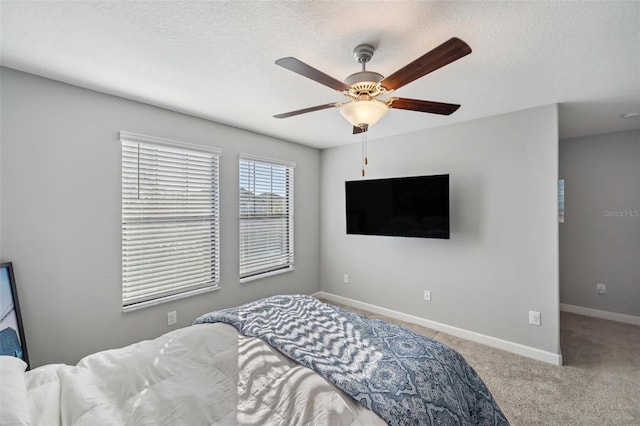 bedroom featuring ceiling fan and light colored carpet