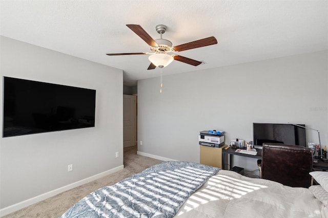 bedroom with ceiling fan and light colored carpet