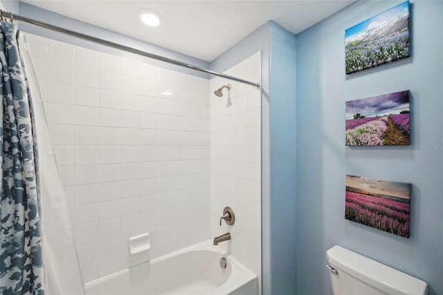 bathroom with toilet and shower / bathtub combination with curtain