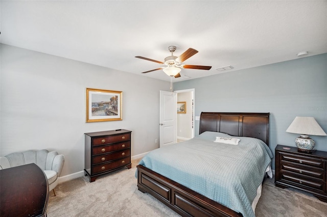 bedroom with ceiling fan and light carpet