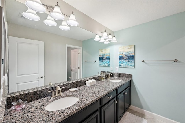 bathroom with tile patterned flooring and vanity