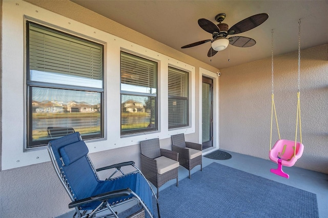 view of patio featuring ceiling fan