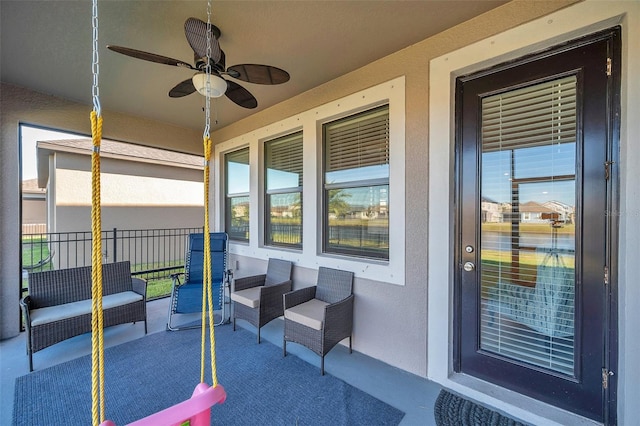 view of patio featuring ceiling fan and covered porch