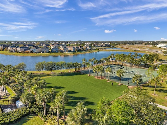 birds eye view of property with a water view