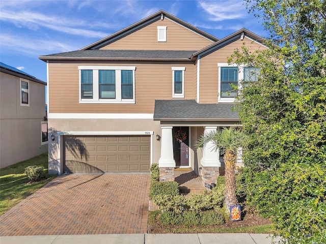 view of front of property featuring a garage