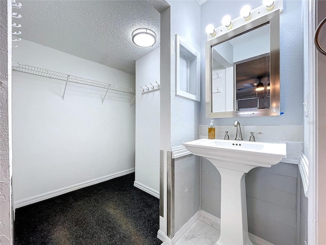 bathroom with a textured ceiling