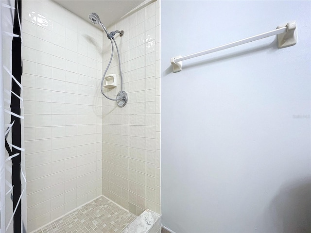 bathroom with a tile shower