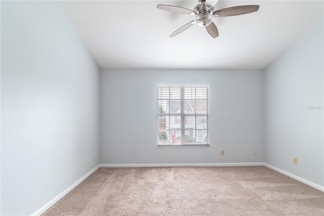 unfurnished room with light carpet and ceiling fan