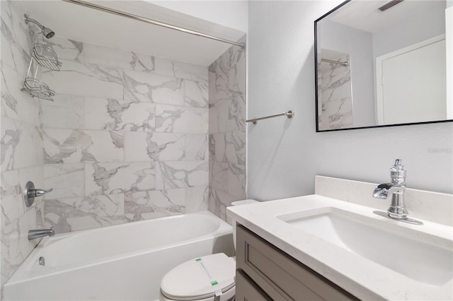 full bathroom with vanity, tiled shower / bath combo, and toilet