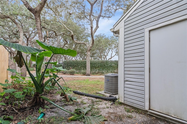 view of yard featuring central air condition unit