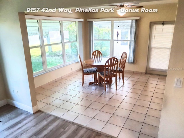 dining area featuring light tile patterned floors