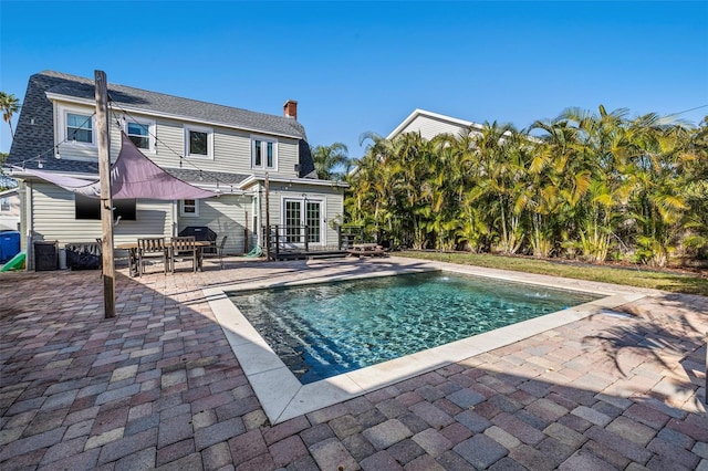 view of swimming pool featuring a patio