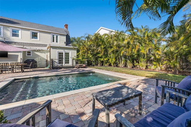 view of pool featuring a patio area