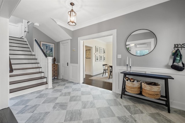 entrance foyer featuring ornamental molding