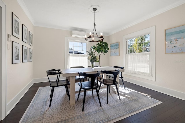 dining space with a wall mounted air conditioner, ornamental molding, dark wood-type flooring, and an inviting chandelier