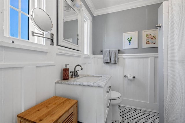 bathroom featuring vanity, toilet, crown molding, and walk in shower