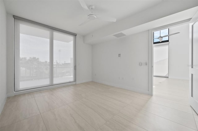 unfurnished room featuring ceiling fan