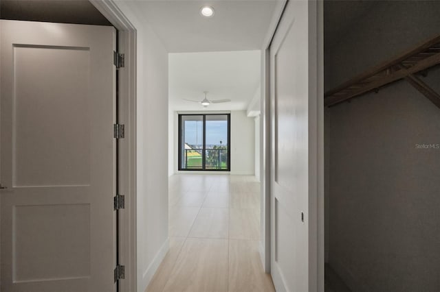 corridor with light tile patterned floors