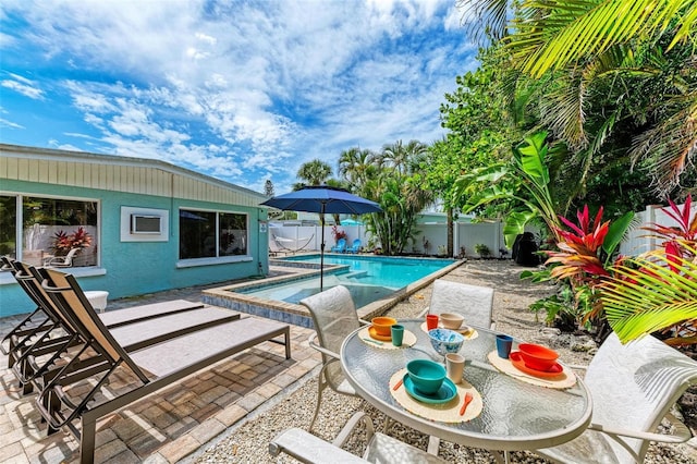 view of pool featuring a patio and a hot tub