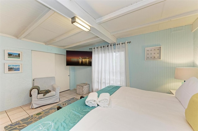 bedroom featuring tile patterned flooring and lofted ceiling with beams